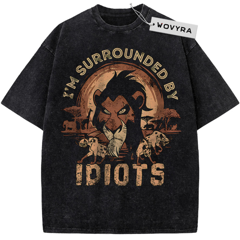 The Lion King Scar Surrounded by Idiots Vintage T-Shirt with Scar and small hyena figures framed by bold gold lettering